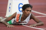 India's Santhi Soundarajan lies on the track after edging out Kazakhstan's Viktoriya Yalovtseva for second place in the women's 800m final on the second day of the athletics competition for the 15th Asian Games at Khalifa Stadium in Doha. Indian athlete Santhi Soundarajan, was stripped of her Asian Games silver medal for what was branded a failed gender test.